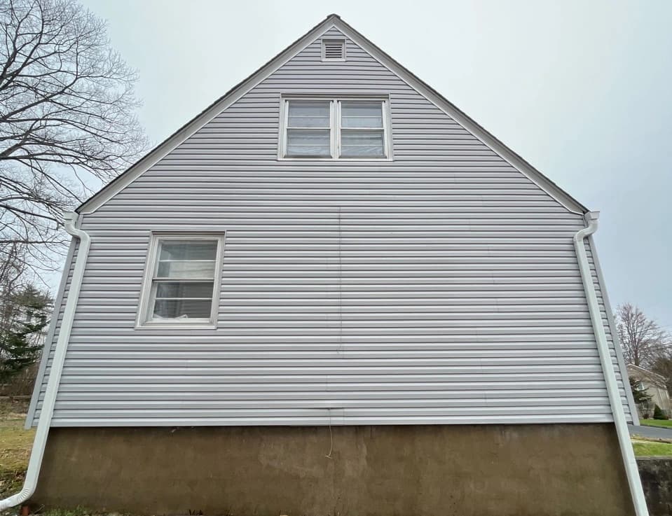 Brunswick Power Washing technician performing detailed house washing in Brunswick residential area